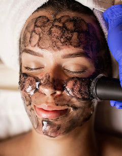 Client receiving a quick 15-minute Hydrafacial at Flash Facial in Dubai Hills Mall — AED 149 walk-in treatment, no booking required